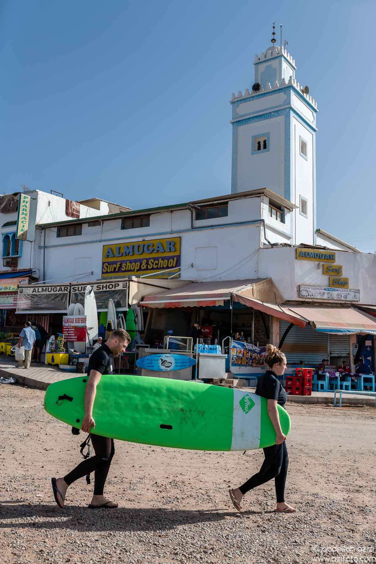 Sufer walking to taghazout beach