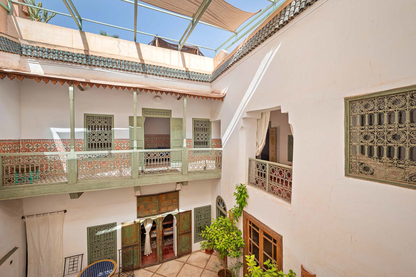 Sunlit central courtyard framed by ornate arches